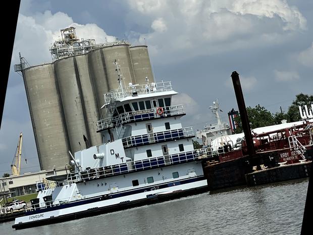 Towboat Everard Dupre moored beside loaded barges